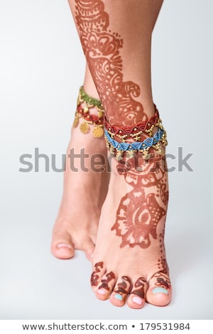 Stock fotó: Legs Decorated With Indian Mehandi Painted Henna