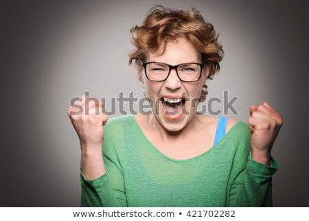 Stok fotoğraf: Happy Woman Clenching Her Fist