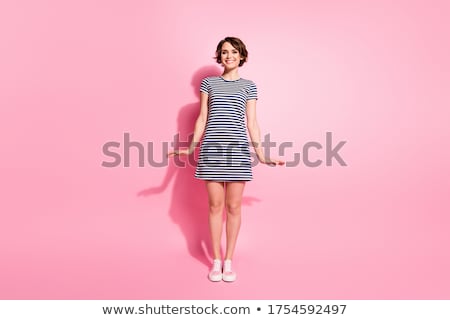 Foto stock: Pretty Young Model In Mini Pink Dress Isolated On White