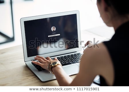 Foto stock: Typing Online Account Password On Laptop Computer Keyboard