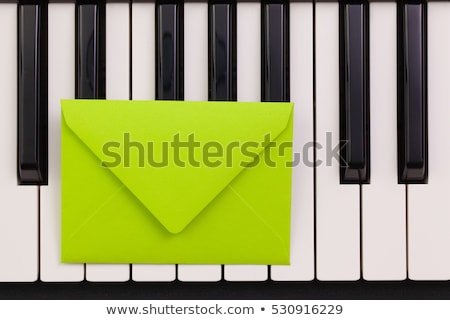 ストックフォト: Funny Arrangement Envelope On The Piano Keybords