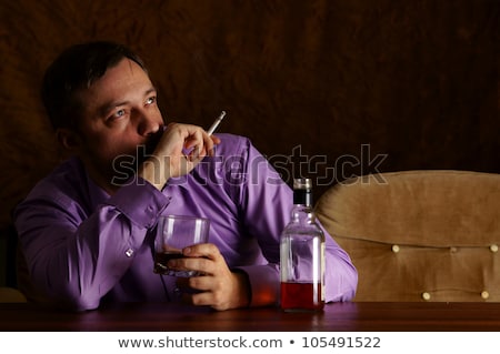 [[stock_photo]]: Drunk Man Drinking Alcohol And Smoking Cigarette