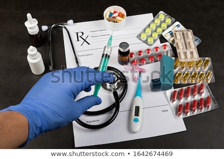 Stock fotó: Hand Of A Doctor With Stethoscope Temperature Fever Flu Or Di