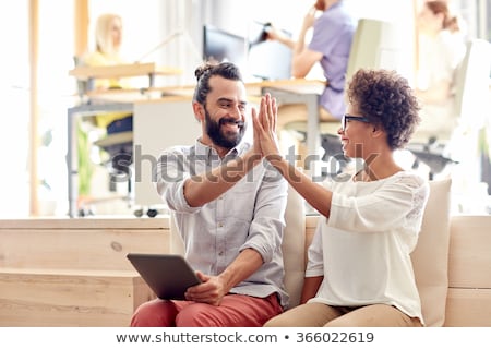 Сток-фото: Happy Creative Team Making High Five At Office