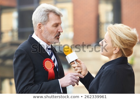 Stockfoto: Politician Being Interviewed By Journalist During Election