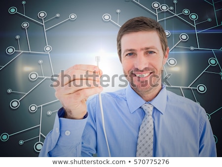 Zdjęcia stock: Businessman Holding A Cable