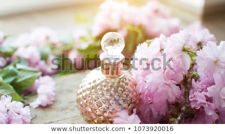 Zdjęcia stock: Arabian Woman With Bottle Of Perfume Isolated On White