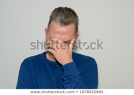 Stock fotó: Despondent Man Covering His Eyes With His Hands