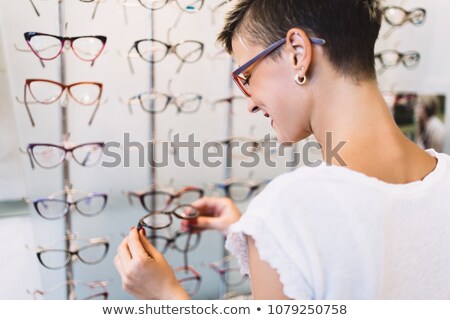 Stock fotó: Adult Ethnic Woman Wearing Oculist Glasses