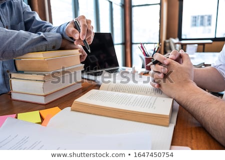 Foto stock: College Tutor Helps Friend Teaching And Learning For A Test Or A