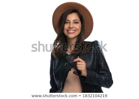 Foto stock: Woman In Leather Jacket Takes It Off While Posing