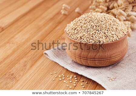 Stock foto: Quinoa In Wooden Bowl On Brown Bamboo Board Close Up Healthy Dietary Groats Background