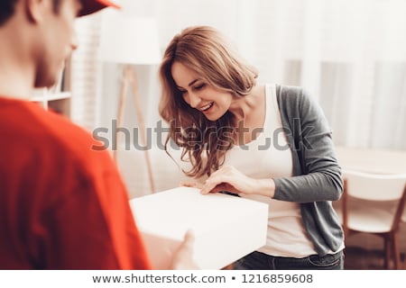 Stockfoto: Man In Red Uniform Delivering Mail Post Boxes