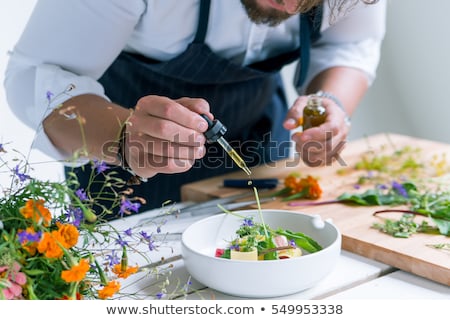 ストックフォト: Group Of Chefs Preparing Food In Kitchen At Hotel