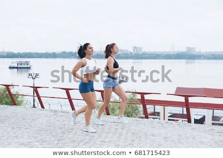 [[stock_photo]]: Scenery Of Two Female Joggers Pursuing Their Activity Outdoors I