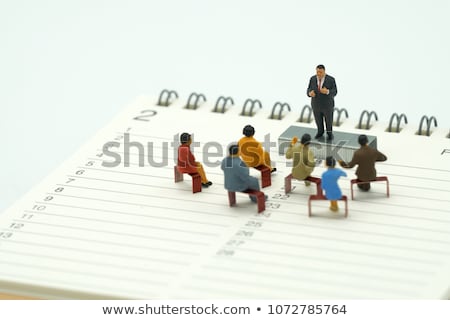 Сток-фото: Model Of Man Sitting On Organizer Or Planner