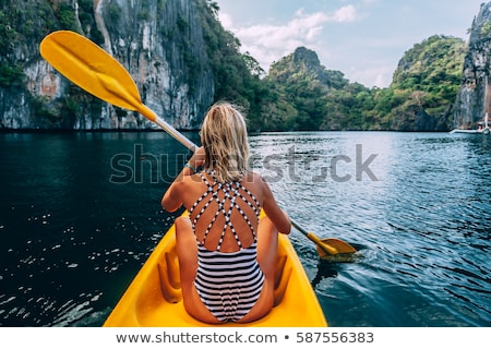 ストックフォト: Young Woman Kayaking On Lake Sea In Boat