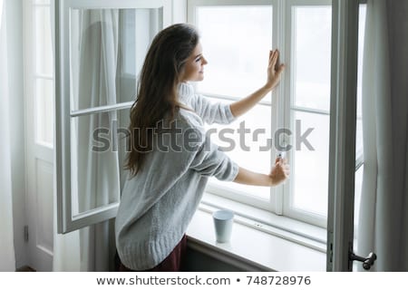 Stok fotoğraf: Beautiful Woman Opens A Window