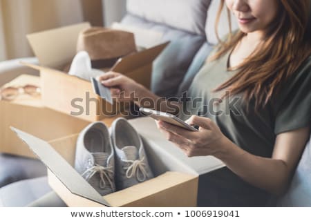 Сток-фото: Young Woman Received Online Shopping Parcel Opening Boxes And Buying Fashion Items By Using Credit C