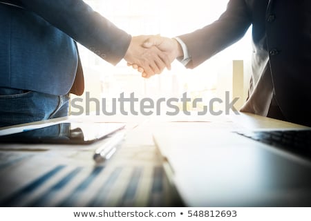 ストックフォト: Two Businessmen Shaking Hands During A Meeting In The Office S