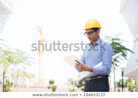 [[stock_photo]]: Construction Worker Read A Plant