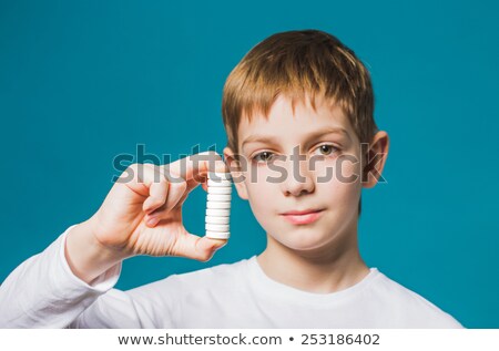 Foto stock: Boy Hold Pill In Hand