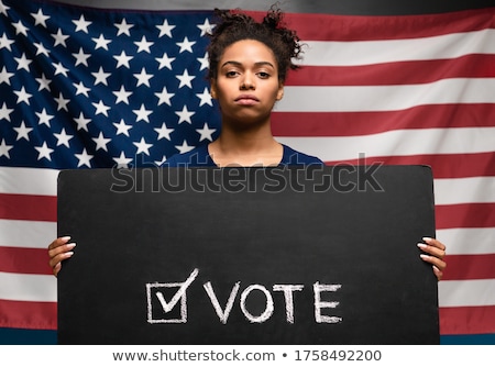 Stok fotoğraf: Woman Holding Vote Sign