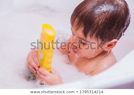 ストックフォト: Little Boy Enjoying A Foamy Bubble Bath