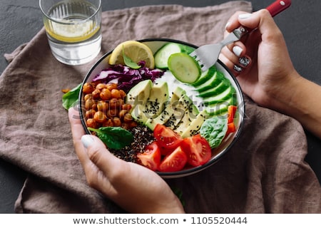 Foto stock: Woman Eating Pepper