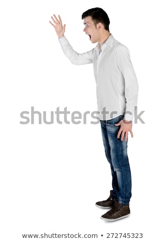 Foto stock: Angry Young Man Shouting And Looking Up At Copyspace