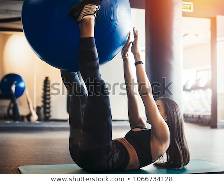 Foto d'archivio: Pilates Woman Fitball Rocking Exercise Workout