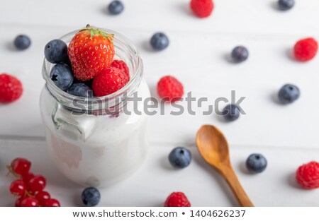 Foto stock: Blueberry And Raspberry Mix In White Ceramic Bowl