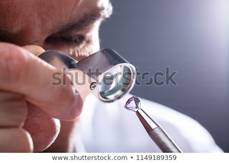 Foto stock: Person Checking Quality Of Diamond