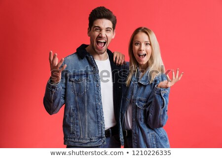 ストックフォト: Portrait Of A Shocked Young Man Dressed In Denim Jacket