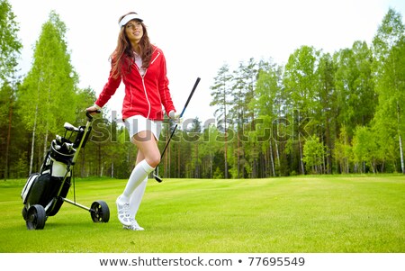 Сток-фото: Female Golf Player Walking On Fairway