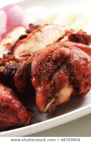 Foto stock: Close Up Of A Plate Of Chopped Tandoori Chicken