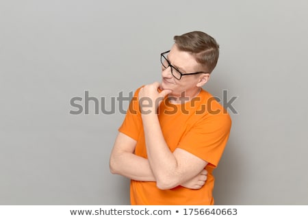 Foto stock: Man Smiling Holding Chin