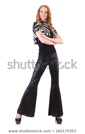 [[stock_photo]]: Redhead Woman In Black Bell Bottom Pants On White