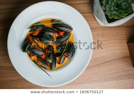 Сток-фото: Clam Soup In White Bowl Wooden Table Background