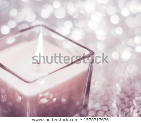 Foto d'archivio: Blush Pink Aromatic Candle On Christmas And New Years Glitter Ba