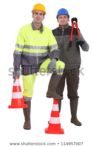 Foto d'archivio: Two Men Stood With Traffic Cones