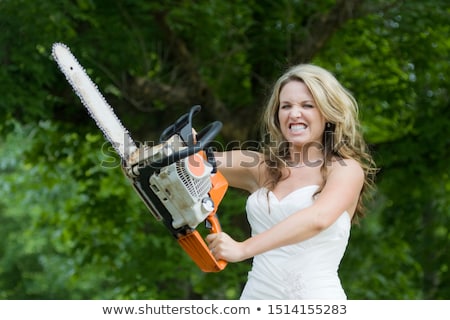 Сток-фото: Pretty Girl With Chainsaw