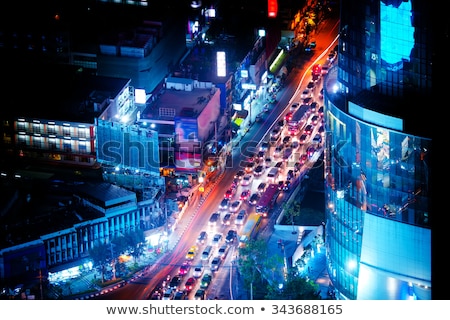 Foto stock: Futuristic Night Cityscape With Traffic Across Street Bangkok Thailand