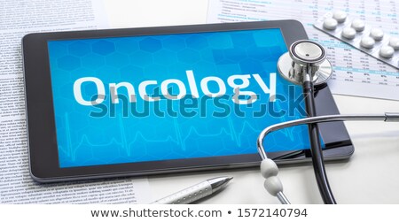 Stock photo: Tablet With The Text Oncology On The Display