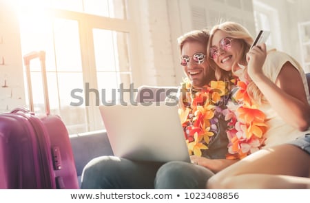 Stockfoto: Young Male Tourist Preparing For Trip At Home