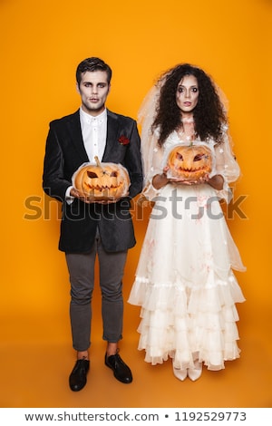 Foto d'archivio: Serious Zombie Groom Looking Camera Isolated
