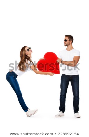 Zdjęcia stock: Happy Young Casual Man Presents A Big Red Heart