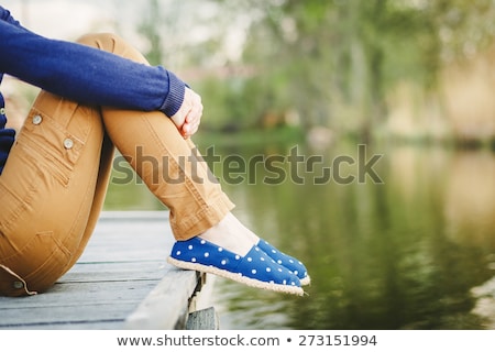 Zdjęcia stock: Cropped Image Of Young Sports Woman Sitting Outdoors