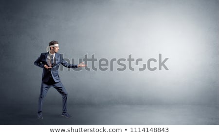 Stock photo: Small Karate Man Fighting In An Empty Space