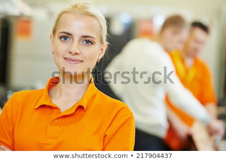 Stok fotoğraf: Sales Assistant Portrait In Home Appliance Shop Supermarket